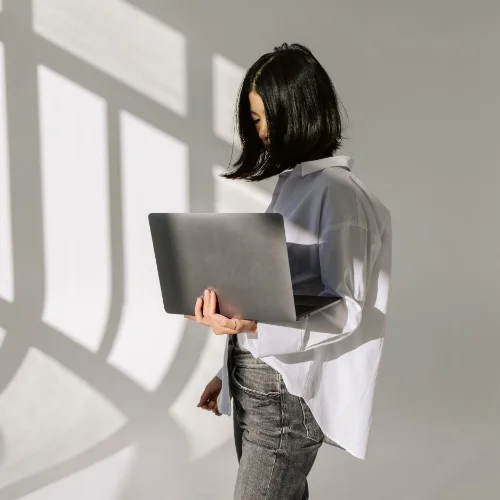 Woman working on laptop, marketing agency Ireland