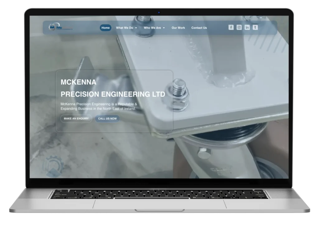McKenna Precision Engineering website on laptop screen.